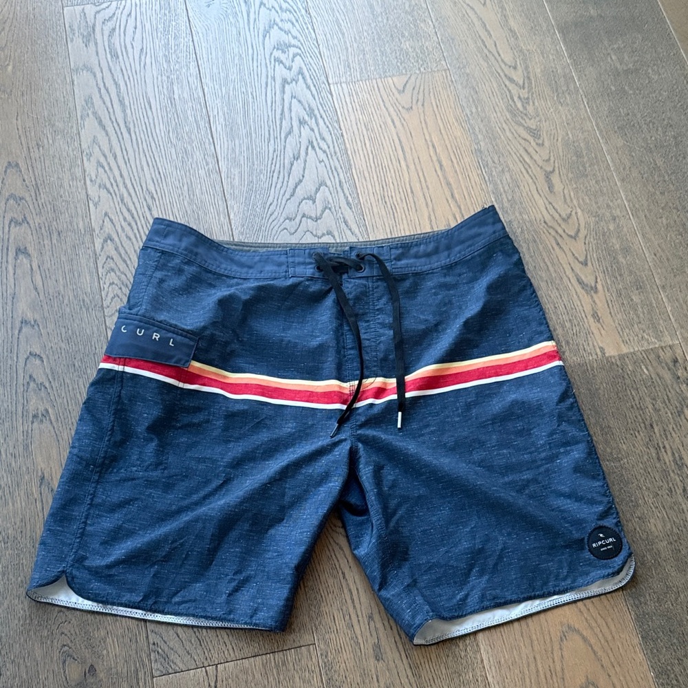 Rip Curl Navy Swim Shorts with Red and Yellow Stripe